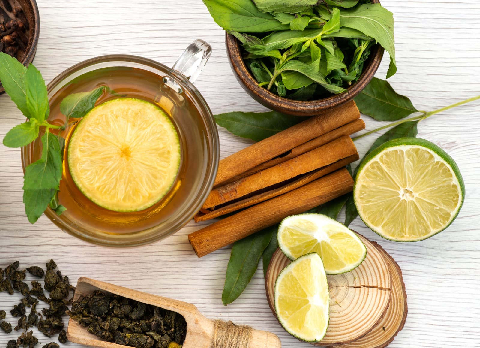 Herbal tea with lime, mint and cinnamon sticks