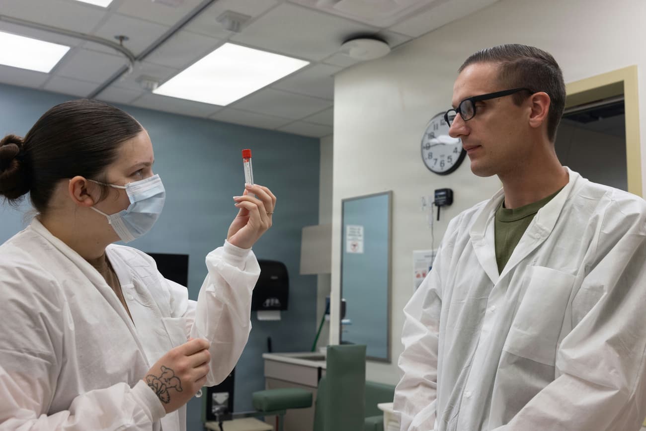 Lab staff inspecting a sample